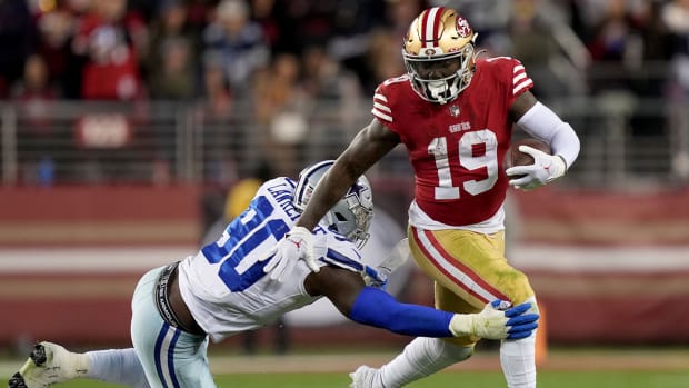 Deebo Samuel tries to break a tackle against the Cowboys during the 2022 playoffs